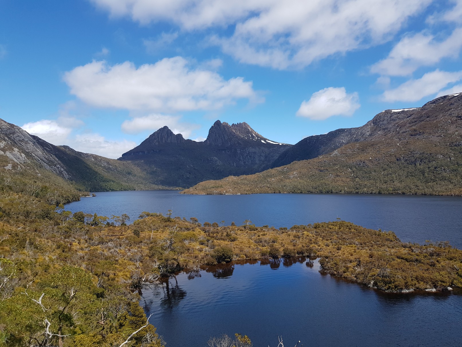 Scenic alpine vistas along Cradle Mountain National Park’s hiking tracks. The Tasmanian Adventure Company provides safe, reliable transport from Hobart.